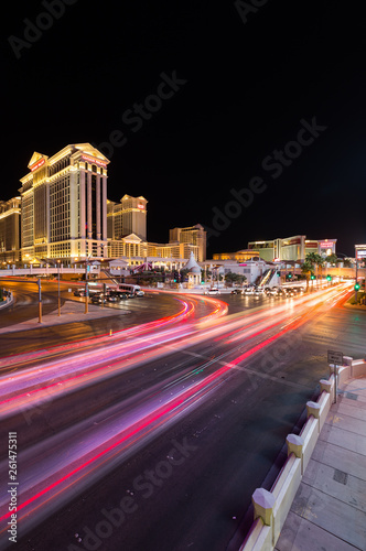 Las Vegas  Nevada   USA - 09.03.2015  Cars at the junction of South Las Vegas Boulevard and West Flamingo Road in front of Caesars Palace on the Las Vegas strip at night.