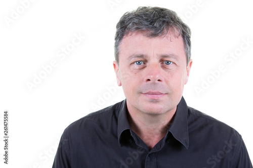 serious mature middle aged man blue eyes looking into camera on white