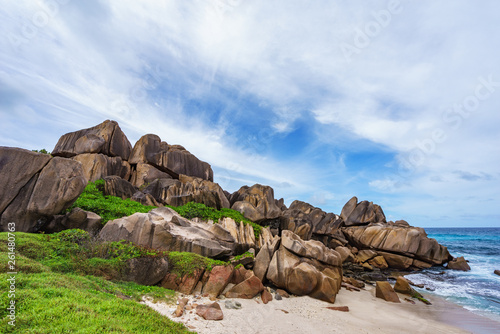 Rough and wild rocky coastline at anse songe, la digue, seychelles 5