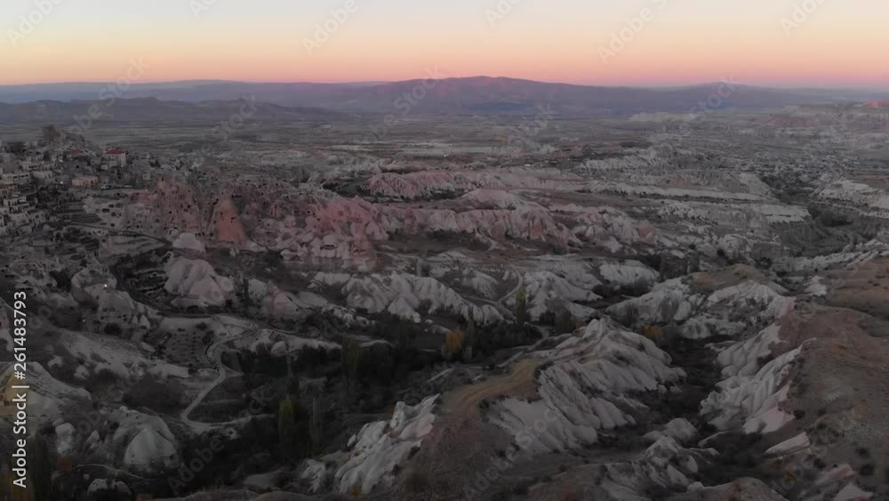 Aerial view to Uçhisar castle and the city, during sunset, Cappadocia, Turkey Aerial view to Uçhisar castle and the city, during sunset, Cappadocia, Turkey