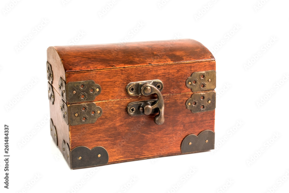Closed wooden box for storing jewelry on a white background Closed wooden box for storing jewelry on a white background