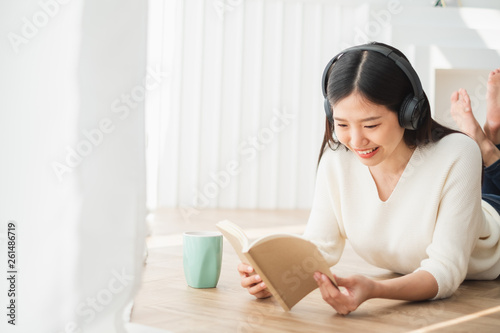 Young beautiful Asian woman listen song music at home, happy lifestyle concept