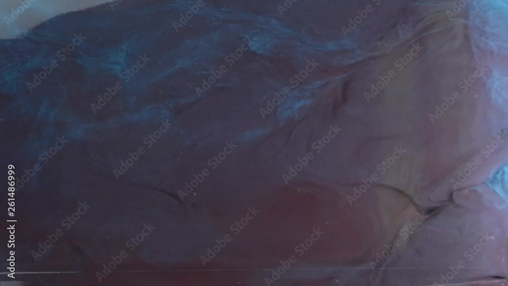 Red and Blue ink in water. Acrylic splash on white background, art, liquid, cloud footage cyan and burgundy colored. Red and Blue ink in water. Acrylic splash on white background, art, liquid, cloud footage cyan and burgundy colored.