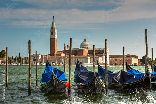 Romantic Venice gondolas parking on grand canal