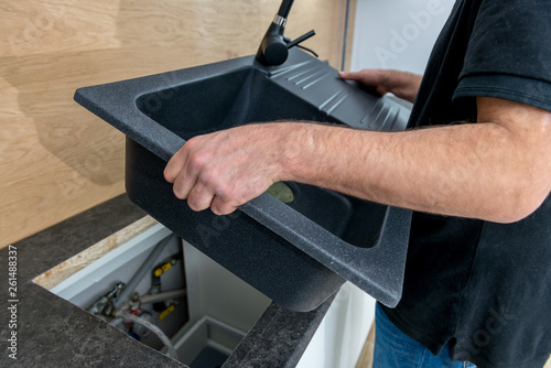 Installing a new ceramic sink in kitchen