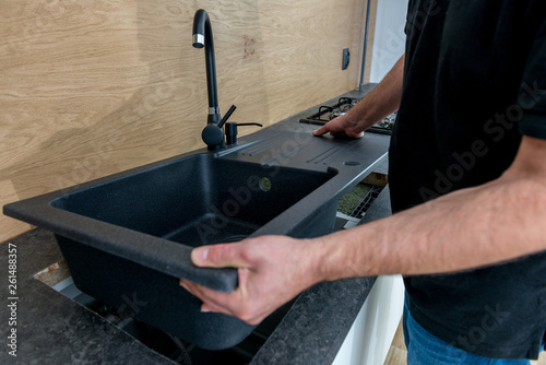 Installing a new ceramic sink in kitchen