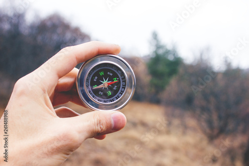 young man hand compass
