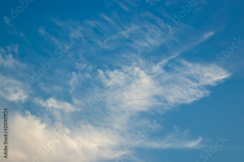 Abstract blurred background Blue sky with white clouds in sunlight.
