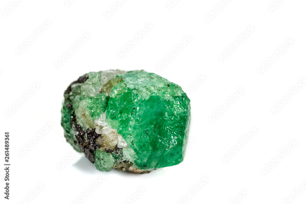 Macro stone garnet mineral, Uvarovite in rock on a white background Macro stone garnet mineral, Uvarovite in rock on a white background