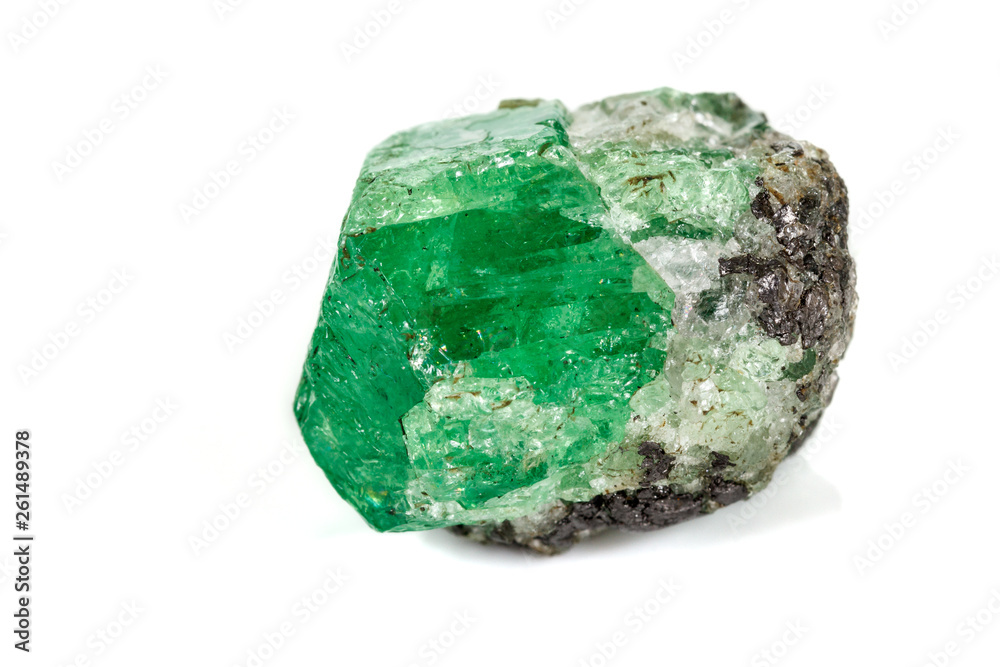 Macro stone garnet mineral, Uvarovite in rock on a white background Macro stone garnet mineral, Uvarovite in rock on a white background