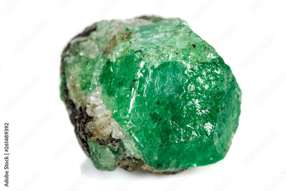 Macro stone garnet mineral, Uvarovite in rock on a white background Macro stone garnet mineral, Uvarovite in rock on a white background