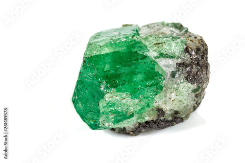 Vászonkép Macro stone garnet mineral, Uvarovite in rock on a white background