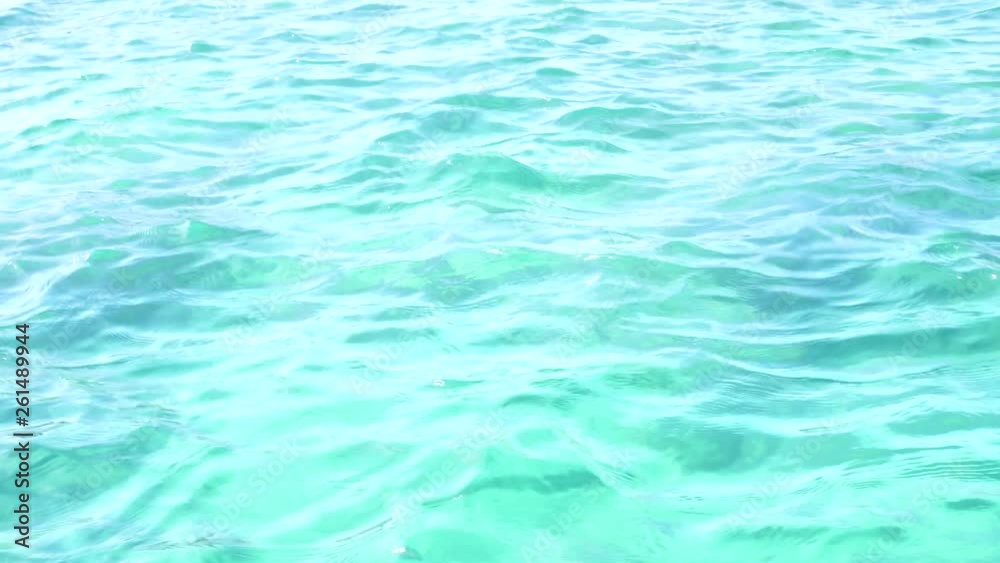 Blue sea wave water ocean surface texture for natural background. Summer sky clear view holiday relax background. Reflection of sunlight or sun shine water natural. Blue sea wave water ocean surface texture for natural background. Summer sky clear view holiday relax background. Reflection of sunlight or sun shine water natural.