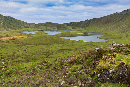 Volcanic crater (Caldeirao) with a beautiful lake on the top of Corvo island. Azores islands, Portugal.