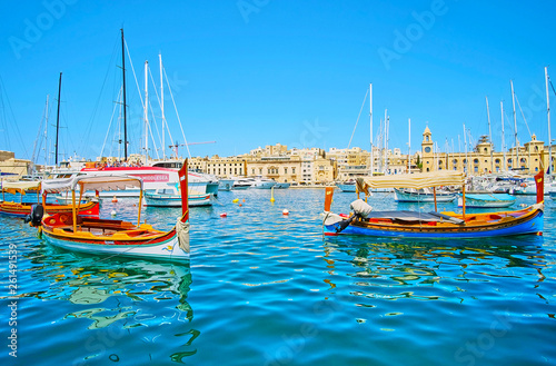 Traditional water taxies in Malta, Birgu photo