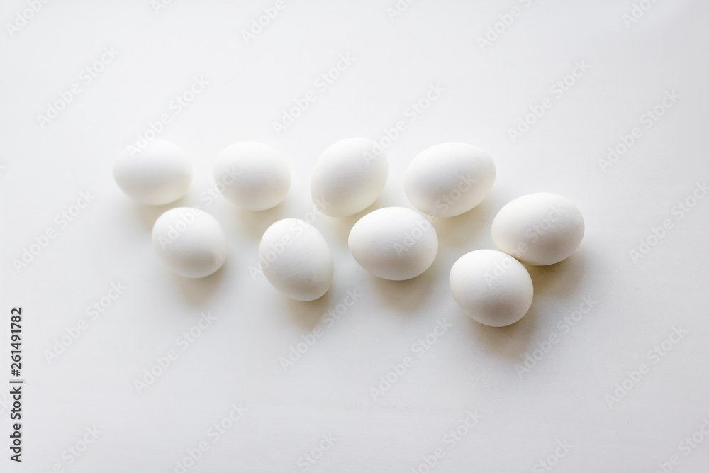  white chicken eggs on white background