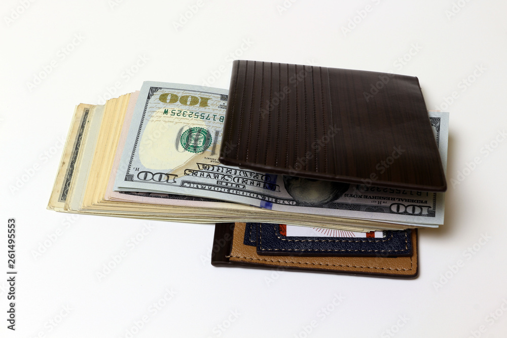Brown wallet with money isolated on white background. Brown wallet with money isolated on white background.