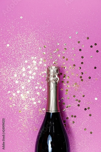 Champagne glasses with splash of golden confetti. Top view. Cele