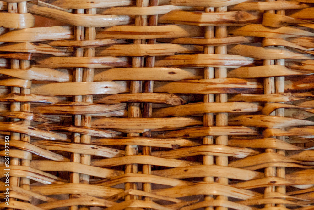 Knitted straw background or weaving pattern background in macro style. Weaving texture classic retro background for design Knitted straw background or weaving pattern background in macro style. Weaving texture classic retro background for design