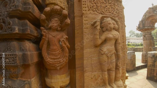 hindu deities apsara and naga bas-reliefs on wall of ancient hindu temple Rajarani Bhubaneswar Orissa photo