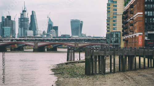 River Thames in low tide with perspective view on The City of London