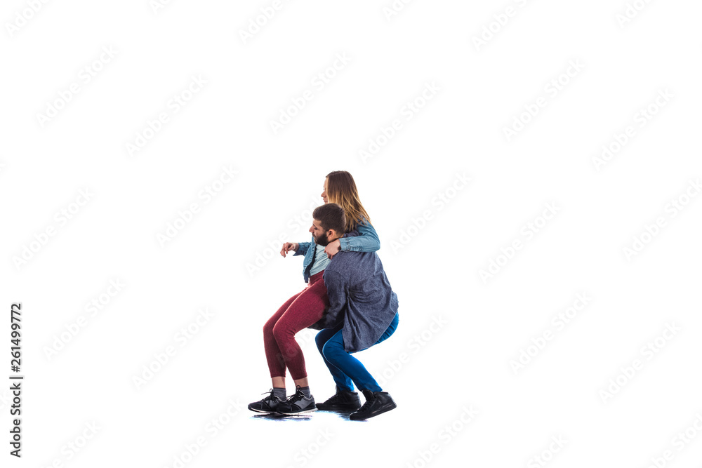 Cheerful man trying to raise up his girl Cheerful man trying to raise up his girl