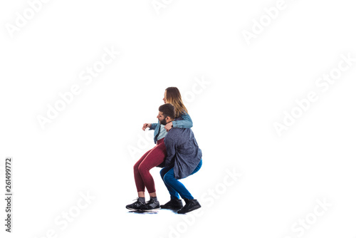 Cheerful man trying to raise up his girl