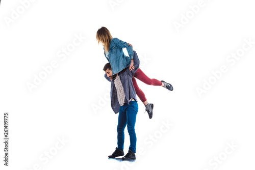 Hip hop couple dancing on white background