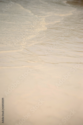 Small waves lapped the beach