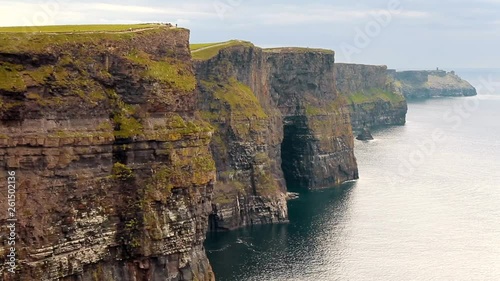 CLIFFS OF MOHER, IRELAND. Real-time footage of the breathtaking landscape along the wild Atlantic Way. Panoramic view of the cliffed coast with the rugged coastline photo