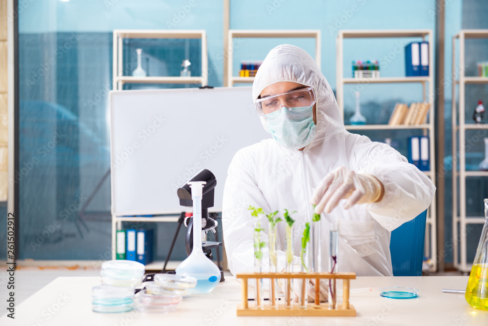 Male biotechnology scientist chemist working in the lab Male biotechnology scientist chemist working in the lab