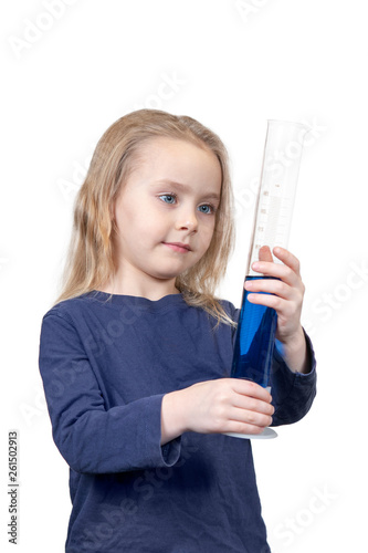 child is looking at the test tube