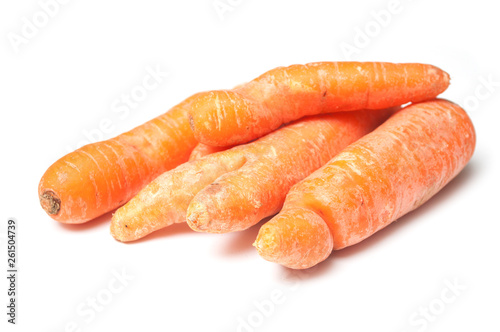 closeup of deformed carrots on white background