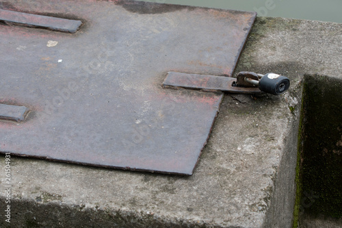 Metal hatch with lock.