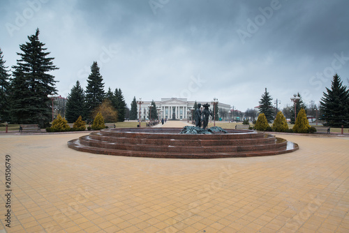 Central square of Molodechno, Belarus with fountain and Molodechno Polytechnic State College photo