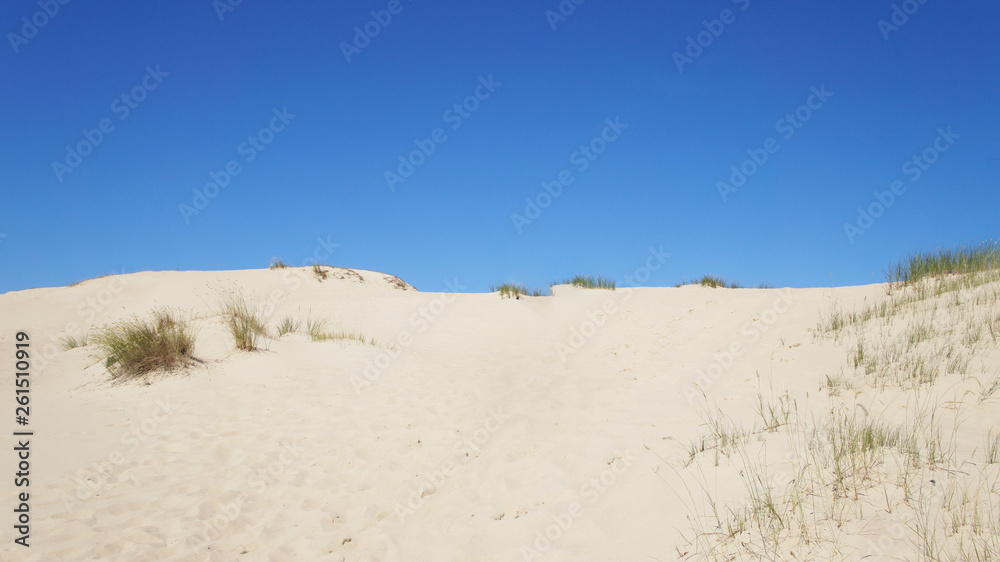 Sand dune against the blue sky for the background. Sand dune against the blue sky for the background.
