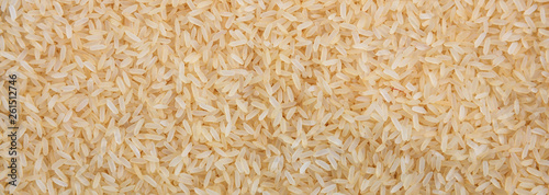 Rice parboiled seeds full frame background, banner