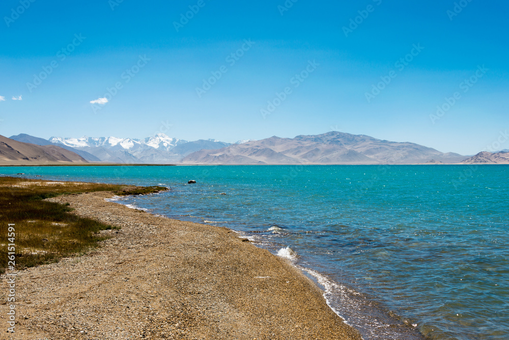 Pamir Mountains, Tajikistan - Aug 20 2018: Karakul Lake in Gorno-Badakhshan, Tajikistan. It is located in the World Heritage Site Tajik National Park (Mountains of the Pamirs).