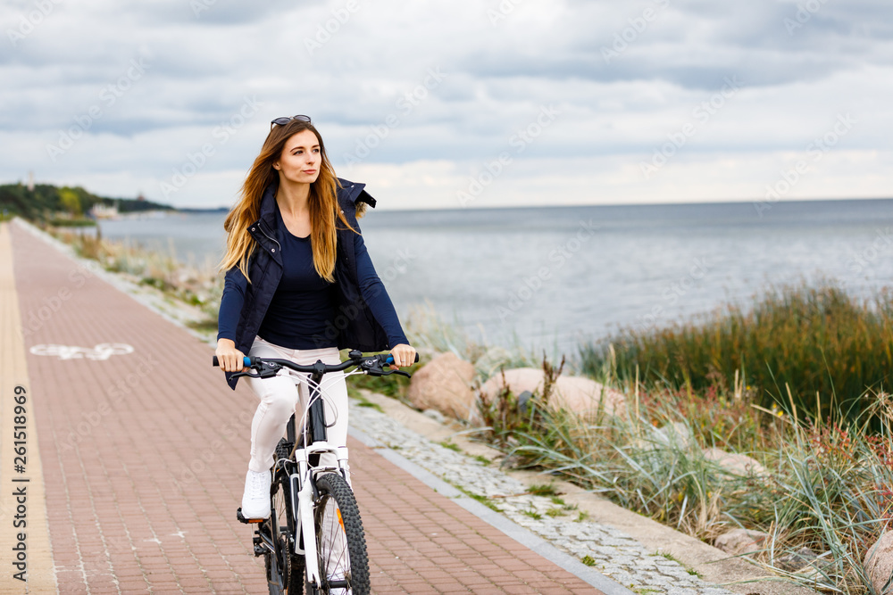 Fototapeta premium Young woman cycling