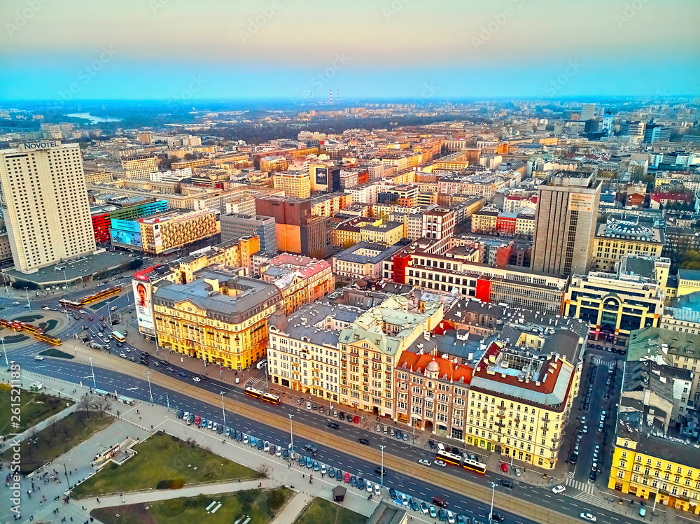 WARSAW, POLAND - APRIL 07, 2019: Beautiful panoramic aerial drone view to the center of Warsaw City in the sunset time in spring