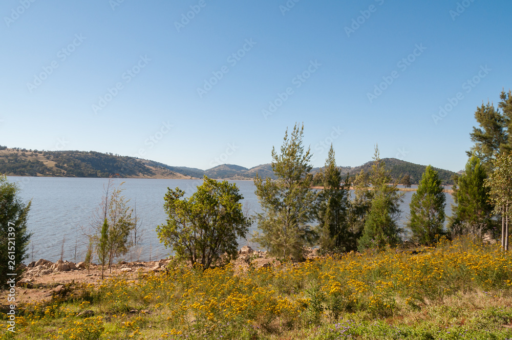 Wild landscape of lake and mountain hills in the distance
