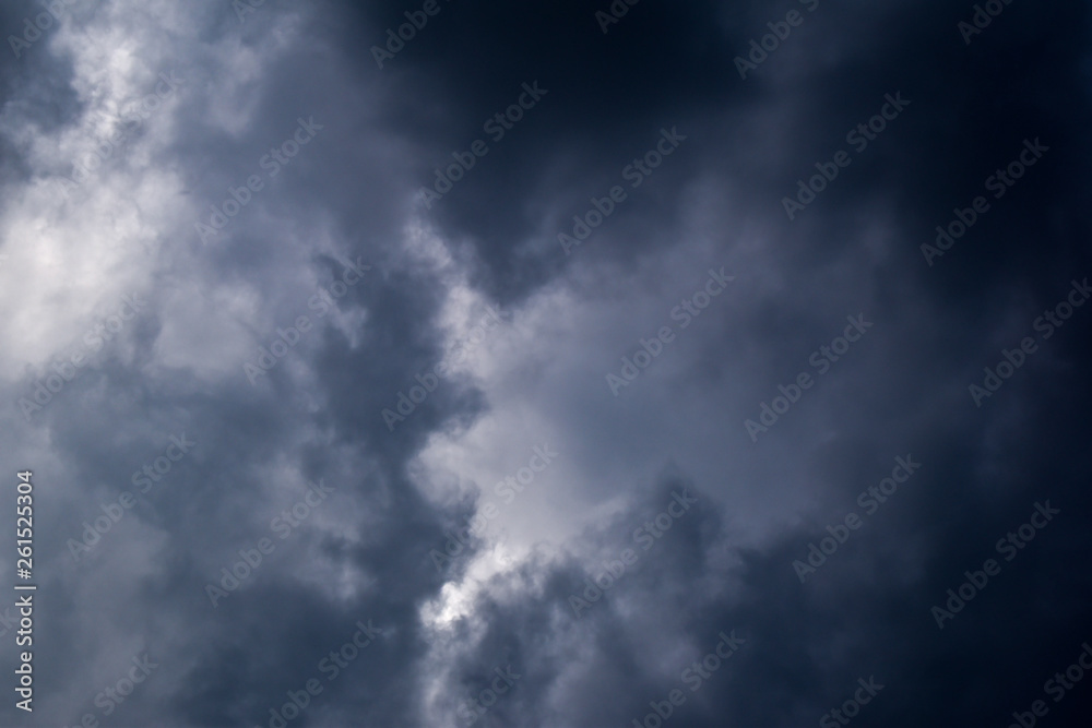 Dark dramatic storm clouds in the sky, before rain. Thunderstorm cloudy background.