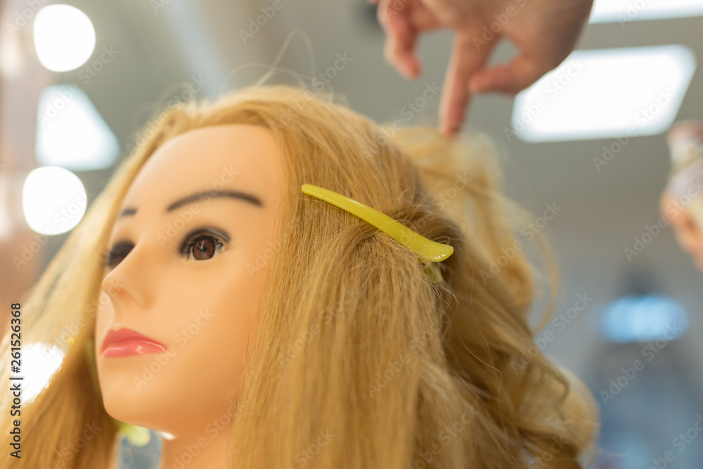 Fototapeta premium Training hairstyles on a mannequin