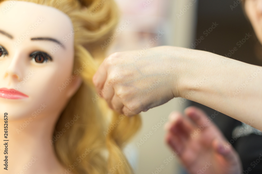 Fototapeta premium Training hairstyles on a mannequin