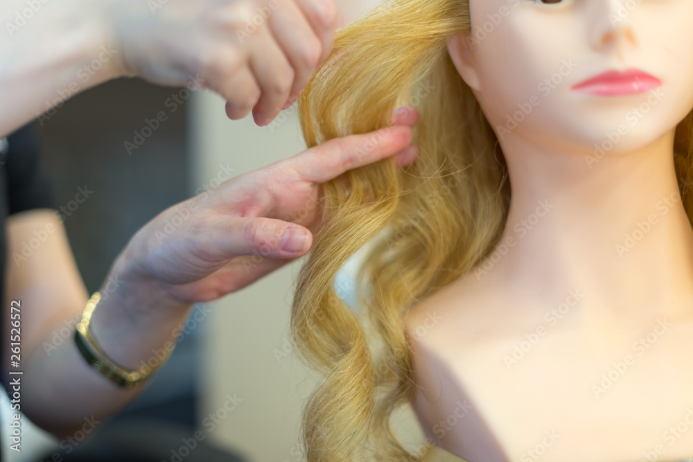 Fototapeta premium Training hairstyles on a mannequin