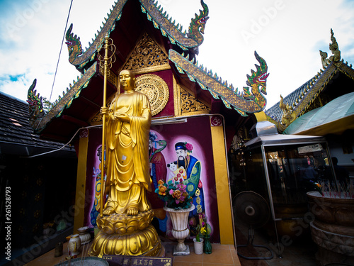 Golden Chinese Monk Statue Standing in Thai Temple