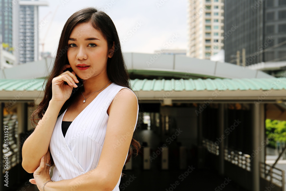 Beautiful Asia business woman happy and traveling in the capital city and walking on street. Beautiful Asia business woman happy and traveling in the capital city and walking on street.