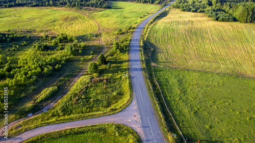 Top view of the road through the agricultural field