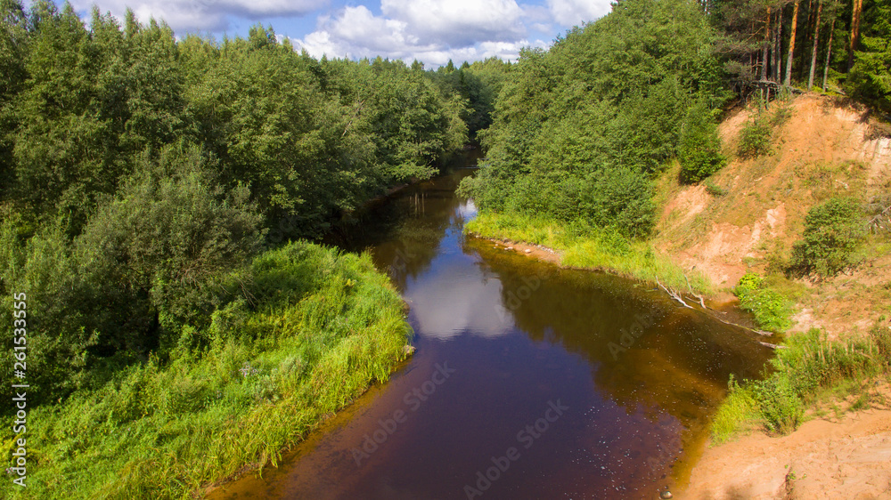 High sandy bank of the Polomet River, Novgorod Region, Russia