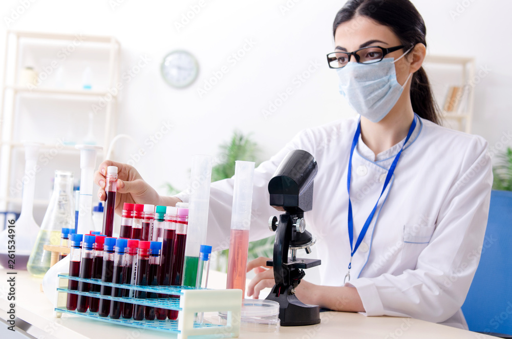 Young female chemist working in the lab Young female chemist working in the lab